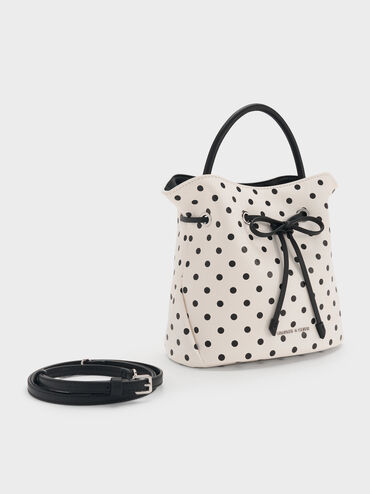 حقيبة باكيت هازل بفيونكة ونقشة منقطة, كريمي, hi-res