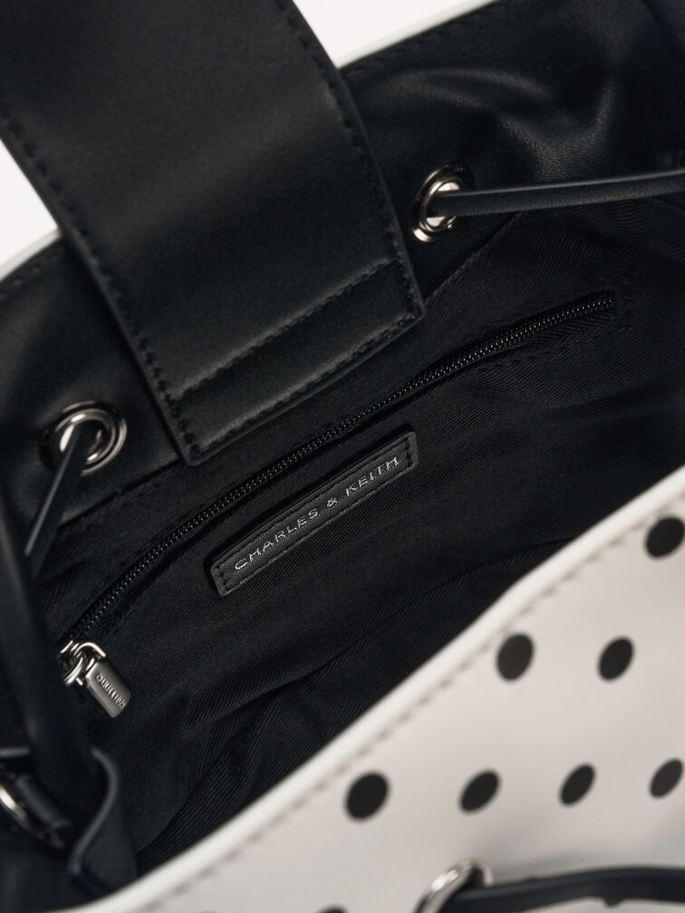 حقيبة باكيت هازل بفيونكة ونقشة منقطة, كريمي, hi-res